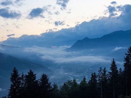 Evening clouds and fog over the Liesingtal, in the valley the village of Traboch, Schoberpass