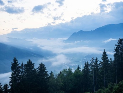 Evening clouds and fog over the Liesingtal, in the valley the village of Traboch, Schoberpass