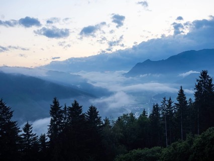Evening clouds and fog over the Liesingtal, in the valley the village of Traboch, Schoberpass