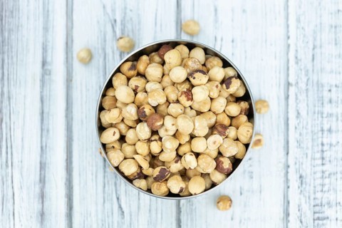 Peeled Hazelnuts as detailed close up shot (selective focus)