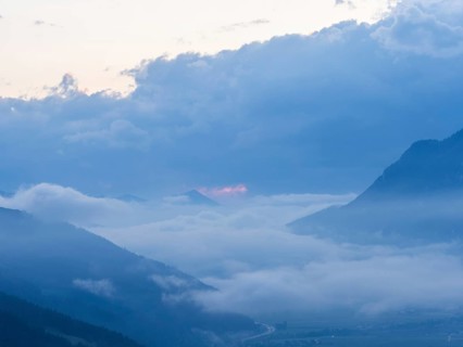 Evening clouds and fog over the Liesingtal, in the valley the village of Traboch, Schoberpass