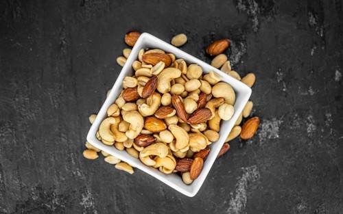 Portion of roasted nuts as detailed close up shot (selective focus)