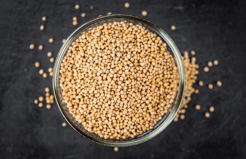 Portion of fresh made Mustard Seeds (close-up shot, selective focus)