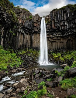 Svartifoss waterfall surrounded by dark basalt columns in Iceland