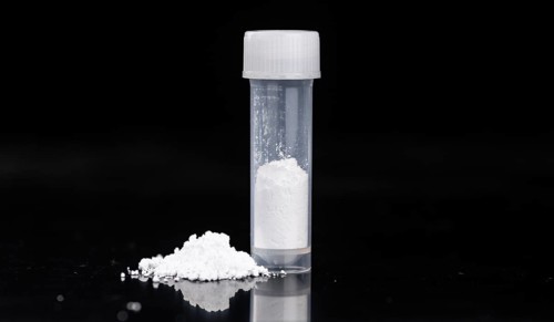 Portion of Cocaine on a dark plate as detailed close-up shot