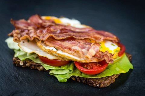 Portion of Bacon and Eggs (selective focus, close-up shot)
