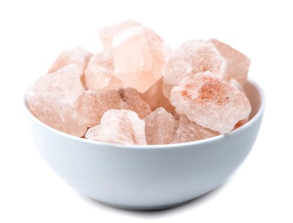 Some parts of himalayan Salt (detailed close-up shot) isolated on white background