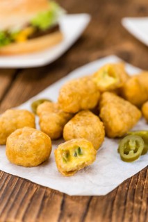 Homemade Cheese Nuggets (with Chilis) on vintage background (selective focus, close-up shot)