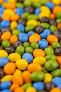 Chocolate coated peanuts as detailed close up shot (selective focus)
