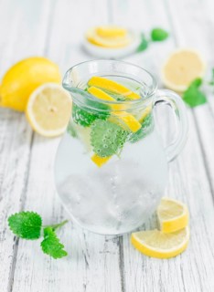 Lemonade on a vintage background as detailed close-up shot (selective focus)