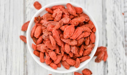 Goji Berries on a vintage background as detailed close-up shot (selective focus)