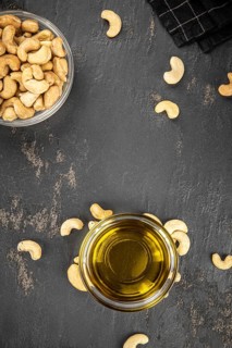 Fresh made Cashew Oil (detailed close up shot, selective focus)