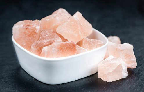 Portion of pink himalayan Salt (detailed close-up shot, selective focus)