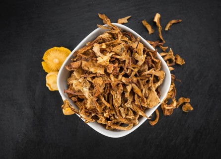 Fresh made Dried Chanterelles on a vintage background as detailed close-up shot