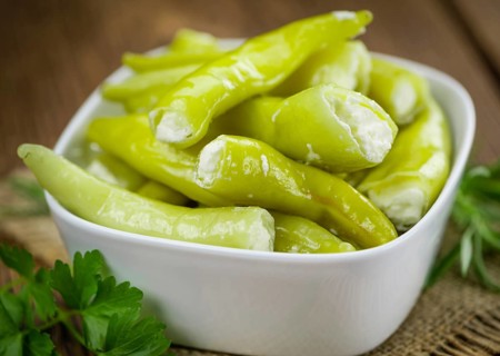 Some homemade Green Chilis (filled with cheese) (selective focus) as detailed close-up shot