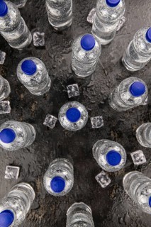 Bottles of chilled sparkling water as detailed close up shot