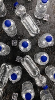 Bottles of chilled sparkling water as detailed close up shot