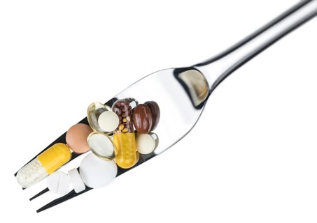 Drugs prepared as meal (close-up shot, selective focus) isolated on white background