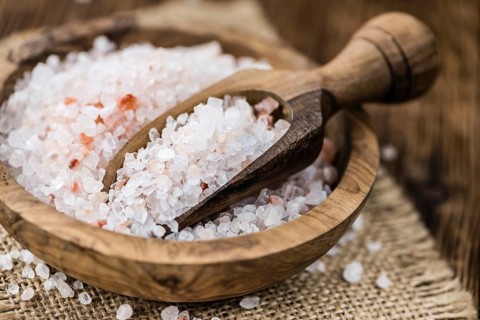 Pink Salt on a vintage background as detailed close-up shot (selective focus)