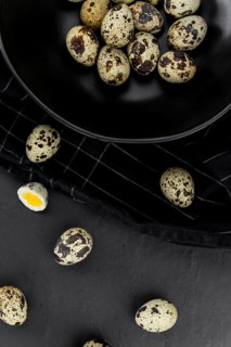 Fresh made Quail Eggs on a slate slab (close-up shot, selective focus)