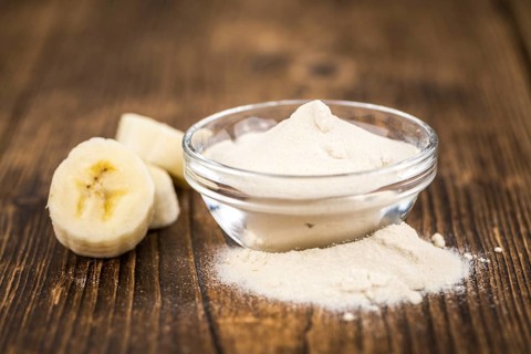 Banana Powder on rustic wooden background as close-up shot