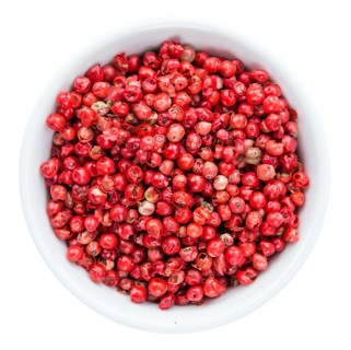 Portion of Pink Peppercorns as detailed close-up shot isolated on white background
