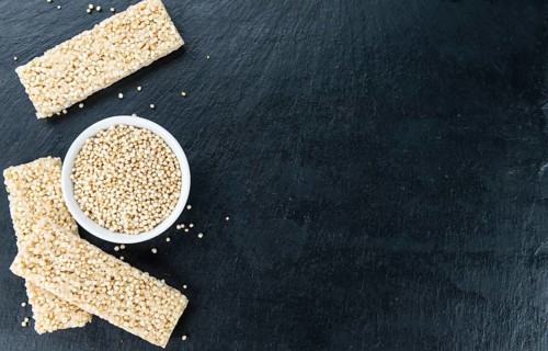 Some Quinoa Bars on a slate slab (close-up shot, selective focus)