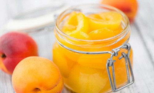 Pickled Apricots on a vintage background as detailed close-up shot (selective focus)