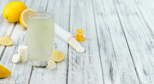 Vitamin C Tablets on a vintage background as detailed close-up shot, selective focus