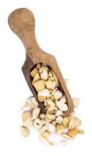 Portion of chopped Cashew nuts isolated on pure white background (detailed close-up shot)