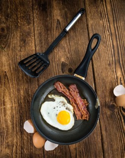 Portion of Bacon and Eggs (selective focus, close-up shot)