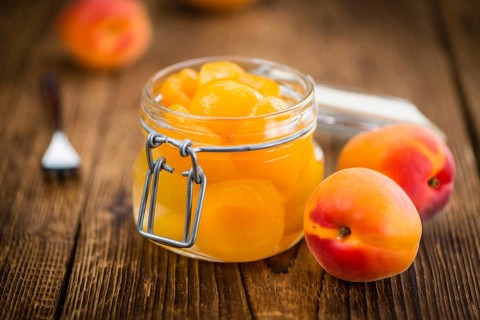Portion of fresh pickled Apricots (close-up shot, selective focus)