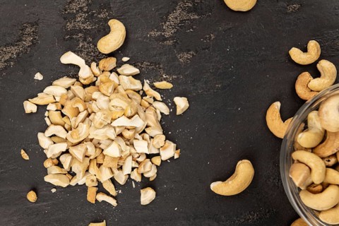 Portion of chopped Cashew nuts (close-up shots, selective focus)