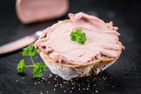 Liverwurst Sandwich on a vintage background as detailed close-up shot (selective focus)