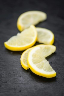 Some Lemon Slices on a vintage slate slab (selective focus)