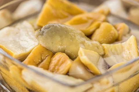 Homemade Preserved Porcinis on an wooden table as detailed close-up shot, selective focus
