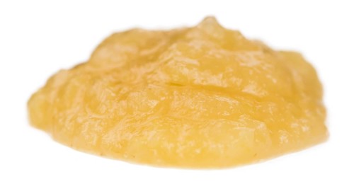 Homemade Applesauce (selective focus) isolated on white background (close-up shot)