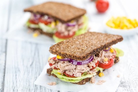Tuna Sandwich (wholemeal bread, selective focus) on an old wooden table