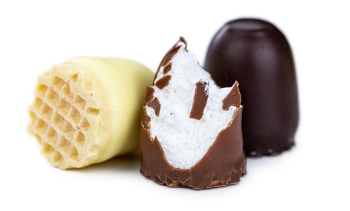 Chocolate Marshmallows isolated on white background (close-up, selective focus)