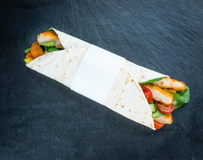 Slate slab with Chicken Wraps as detailed close-up shot (selective focus)