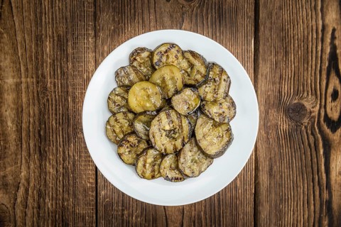 Homemade Antipasti (Grilled Zucchinis) on vintage background (selective focus, close-up shot)