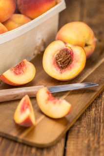 Portion of fresh Peaches close-up shot, selective focus
