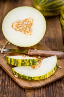 Portion of fresh Futuro Melons (close-up shot, selective focus)