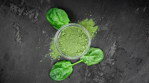 Freshly made green spinach powder (detailed close up shot, selective focus)
