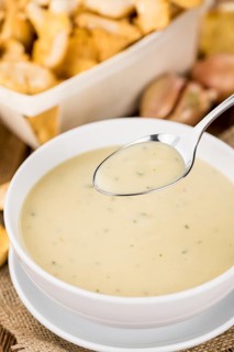 Fresh made Chanterelle Soup on a vintage background as detailed close-up shot