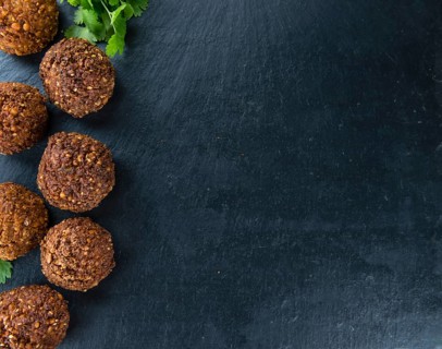 Homemade Falafel (close-up shot, selective focus) on wooden background