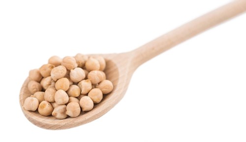 Portion of Chickpeas as detailed close-up shot isolated on white background
