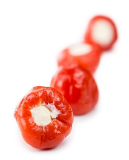 Filled Pimientos isolated on white background (selective focus, close-up shot)