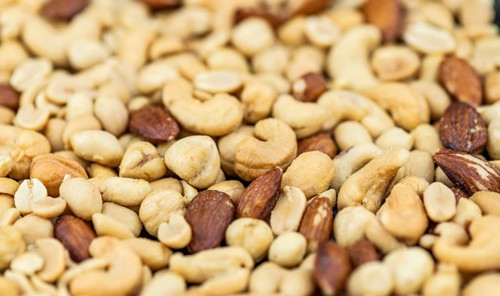 Roasted and salted nuts for use as background image or as texture (close up shot)