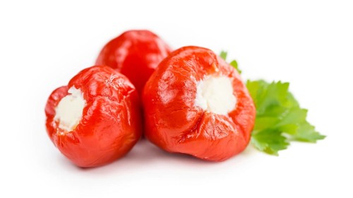 Fresh made Red Pepper (stuffed with cheese) isolated on white background (close-up shot)